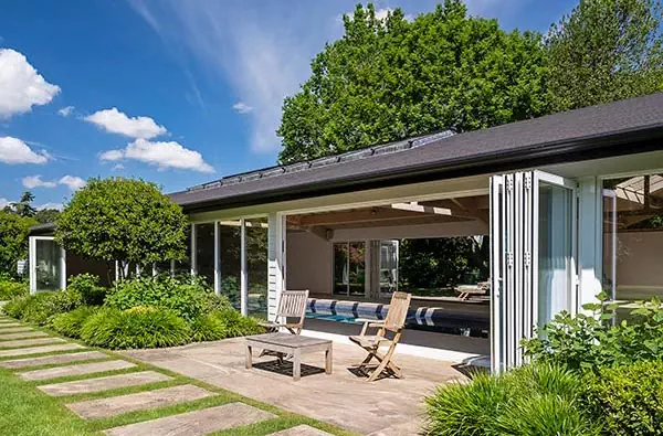 Converted outdoor pool to indoor with bifold doors