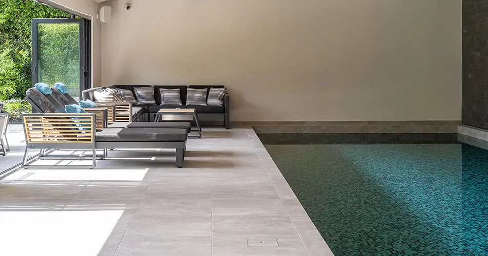 Turning Detail Into Definition Indoor Pool with Seating Area