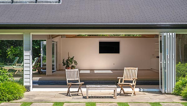 looking into an indoor pool house with a heated pool